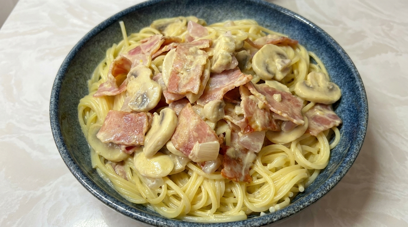 Spaghetti Cremosi con Pancetta e Funghi