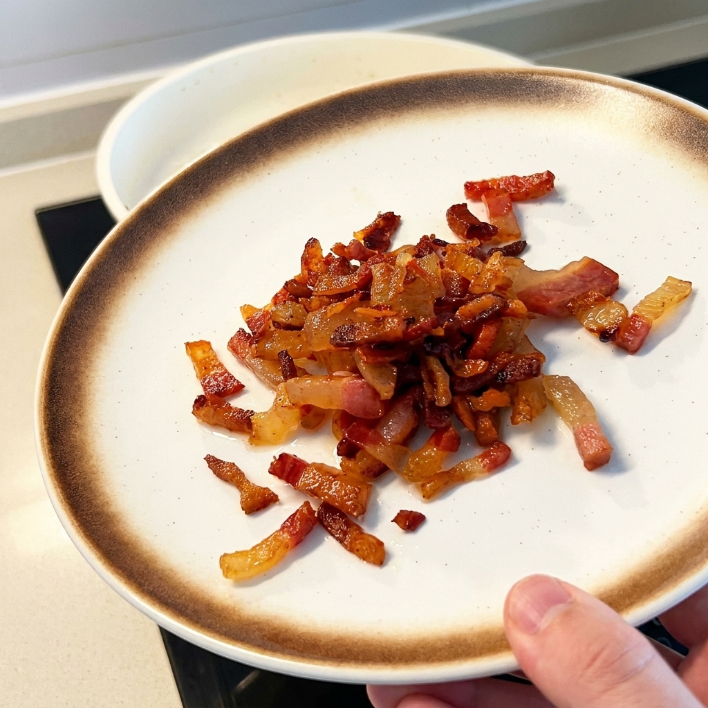 Pasta di tuorlo duovo salato mescolata nel grasso dorato sciolto.