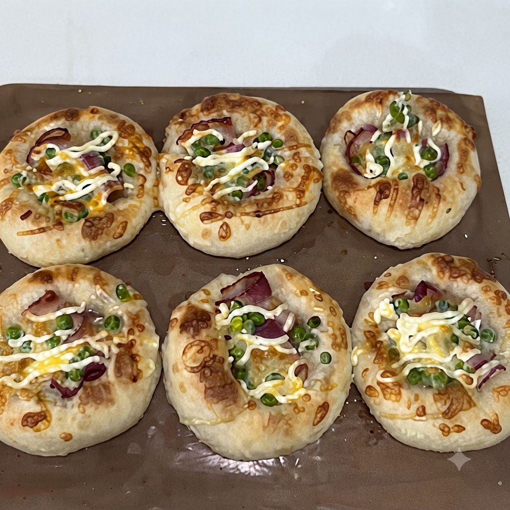 Piselli verdi cosparsi sopra lo strato di pancetta allinterno degli incavi dellimpasto.